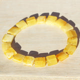 Baltic Amber Square Bracelets. One elastic strings expand to fit all wrists. Comes with lovely gift boxes. available in 5 colours