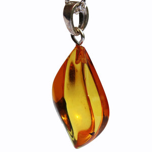 Beautiful Baltic Honey Amber Pendant with sterling silver hoop. Comes with lovely gift box. Make a set with matching twist earrings.