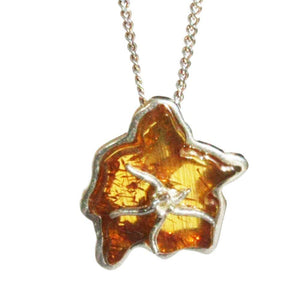 Romantic designer cognac or cherry Amber flower pendants consist of sterling silver fittings and flower shaped amber. earrings, ring makeset