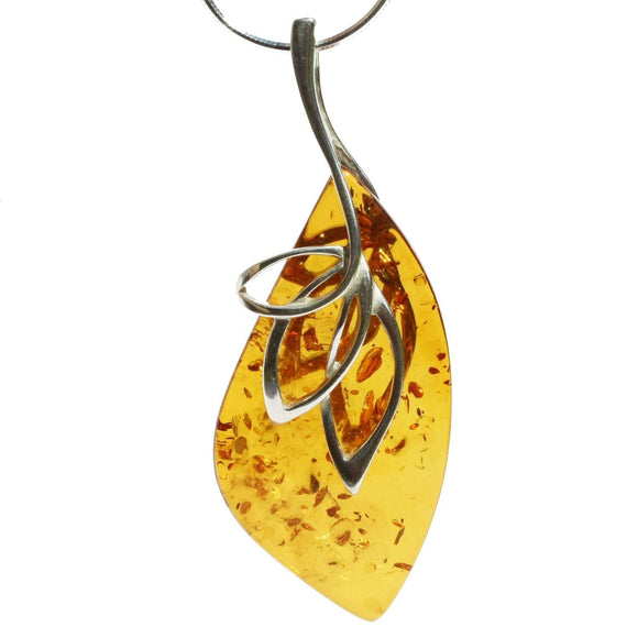 Intricate honey or cherry amber earrings crafted from sterling silver 925 and genuine baltic amber. A distinctive and striking design