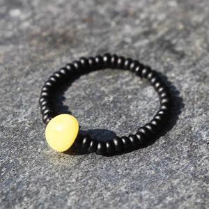 Minimalist Ring Amber and black glass beads. One elastic string expands to fit all wrists. Match with anklet or bracelet. Amber Jewellery