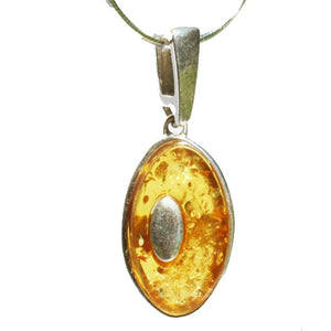 Individually crafted oval portion of honey or cherry amber have been set onto st. silver to create this spectacular pendant. earrings, ring