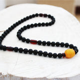 Unpolished black cherry and unpolished butterscotch amber bead Necklace.